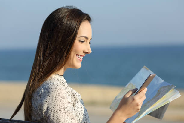 istock Tourist consulting location with a map and smart phone 915213516