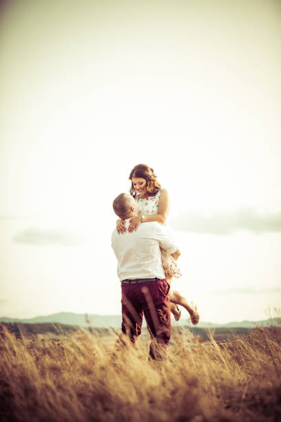 istock Loving couple in summer meadow 915214496
