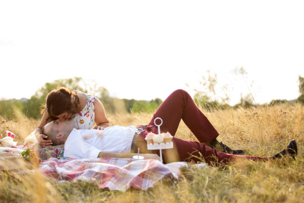 istock Loving couple enjoying picnic in nature 915214782