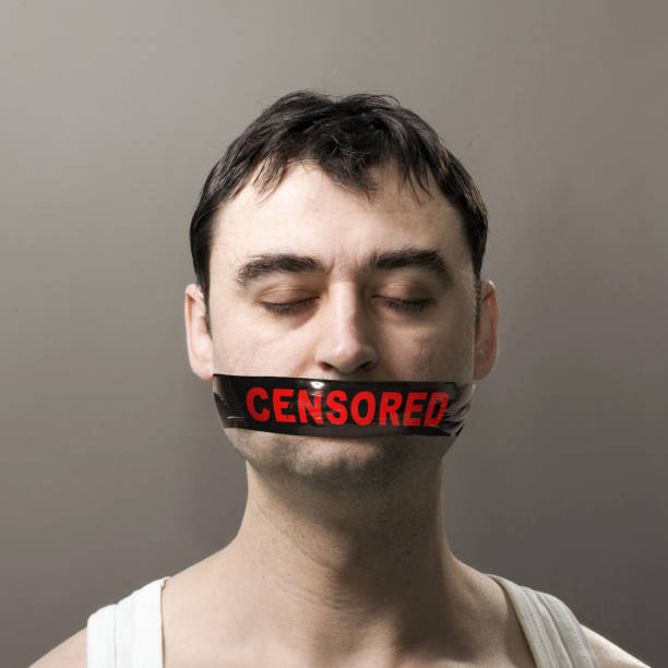 istock man with censored tape on face 915217266