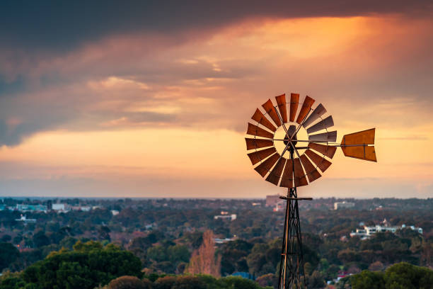 Vintage windmill at sunset viwed from Adelaide Hills, South Australia
