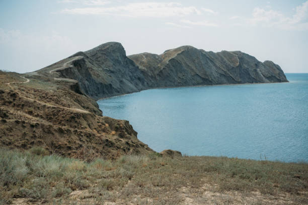 istock Scenic calm seashore with Crimean mountains ridge, Ukraine, May 2013 915217844
