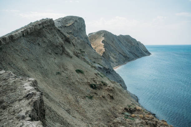 istock Scenic calm seashore with Crimean mountains ridge, Ukraine, May 2013 915217860