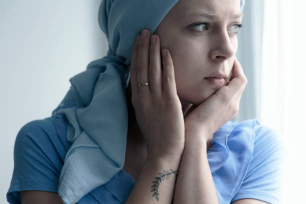 Sick woman touching face Portrait of sick woman with headscarf touching face after radiotherapy chest tattoo pain stock pictures, royalty-free photos & images