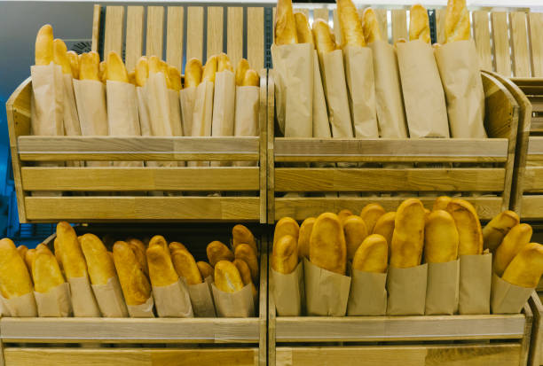 Focus on shelves with bread in a supermarket