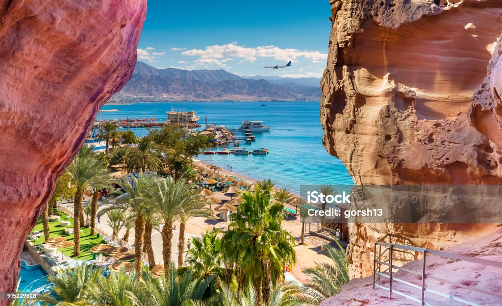 Central public beach and marina in Eilat - famous resort and recreation city in Israel Eilat is a serene location that is a very popular tropical getaway for Israeli and European tourists. Israel Stock Photo