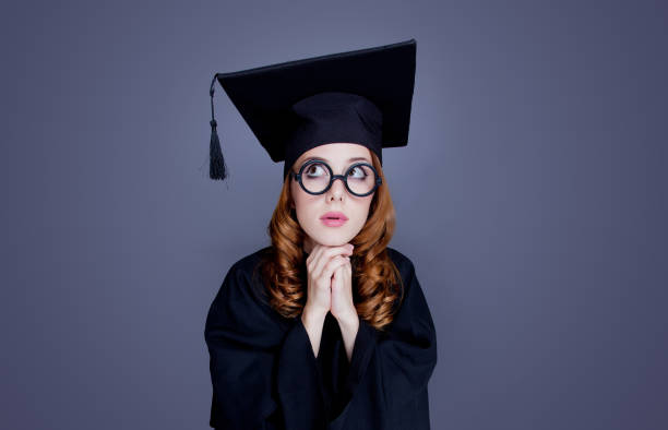 istock graduate girl in square academic cap and mantle 915230116