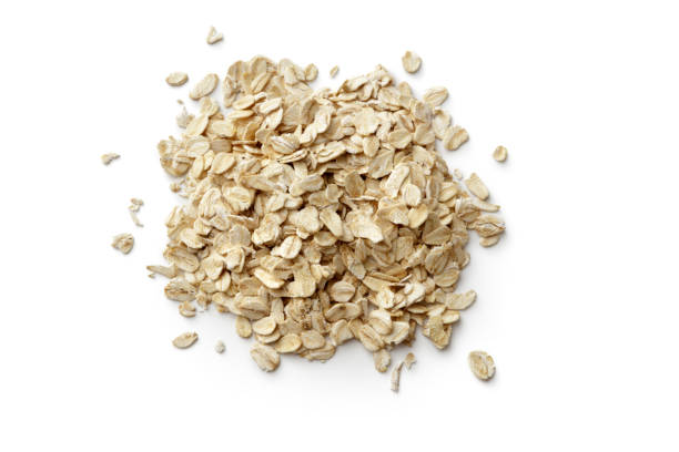 breakfast ingredients: oats isolated on white backgroundbreakfast ingredients: - oat imagens e fotografias de stock