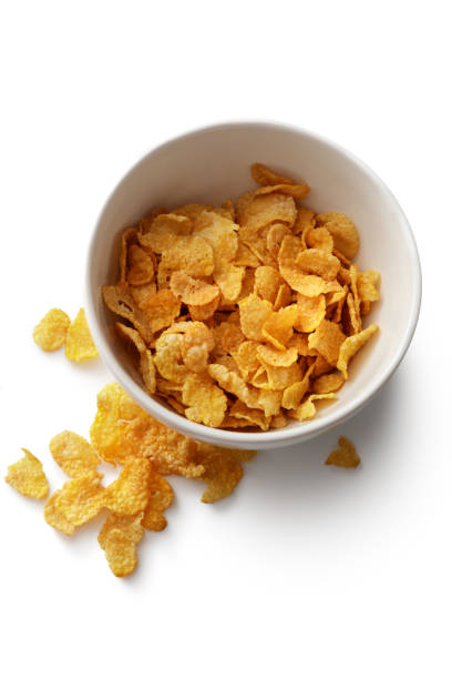 istock Breakfast Ingredients: Cornflakes Isolated on White Background 915234144