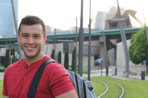 istock Mixed ethnicity student smiling outdoors 915236578