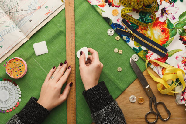 istock Top view on fashion designer working at messy table 915237452