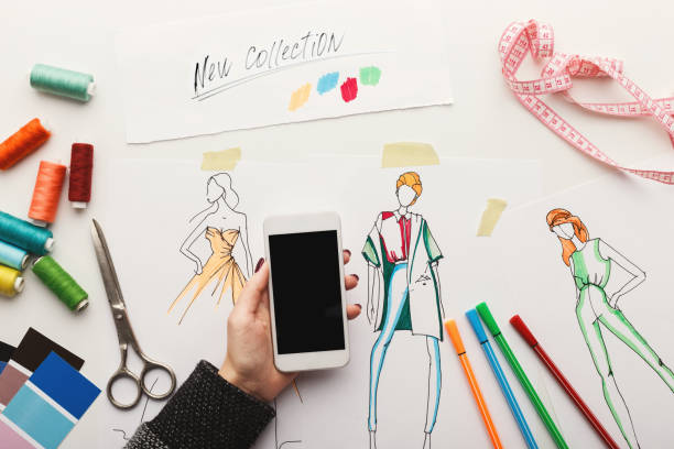 istock Top view on woman designer drawing clothes sketches 915237704