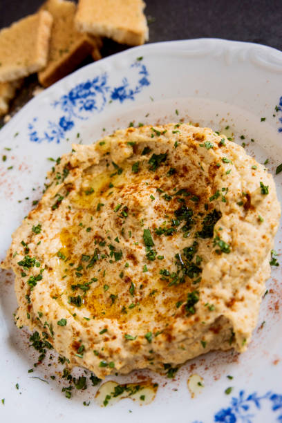 istock homemade classic hummus with fresh herbs 915237872