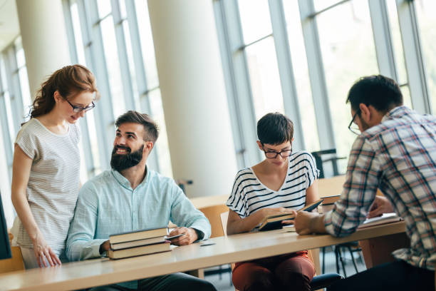 istock Group of young students studying together 915243822