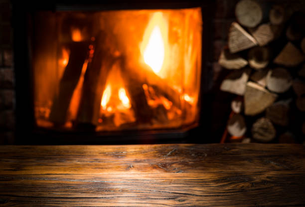 istock Old wooden table and fireplace. 915243886