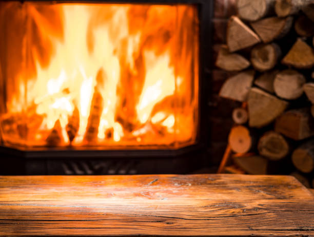 istock Old wooden table and fireplace. 915244000