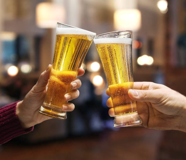 istock Beer glasses raised in a toast. 915244130