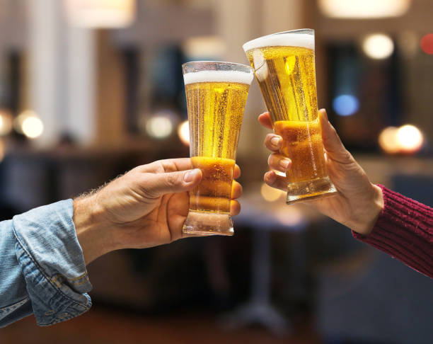 istock Beer glasses raised in a toast. 915244164