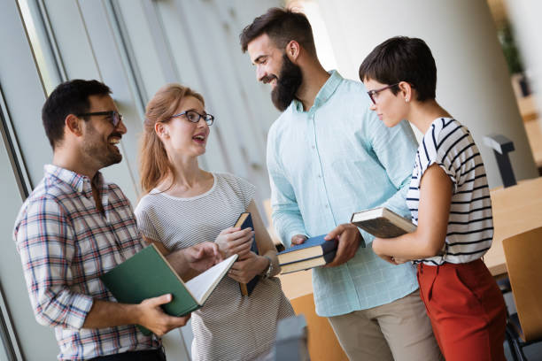 istock Group of young students studying together 915246758