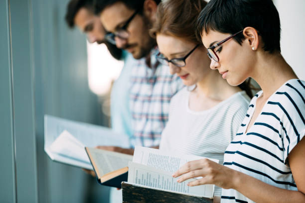 istock Group of young students studying together 915246840