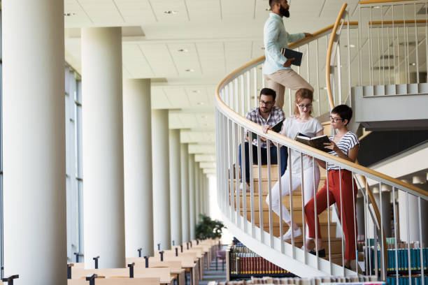 istock Group of students discussing in university 915246908