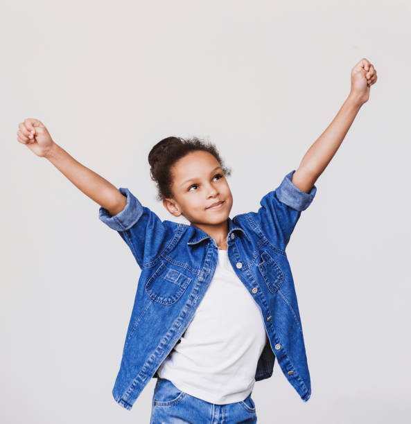istock Happy little girl cheering 915246946