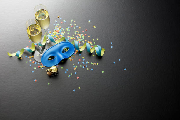 Party: Champagne, Streamer, Mask and Confetti Still Life