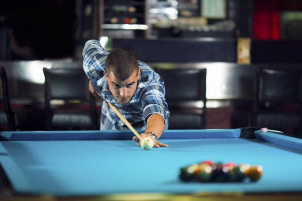 istock Young man at pool club 915247626