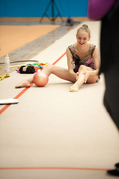 istock Smiling Young Rhythmic Gymnastics Athlete Warming Up 915251464