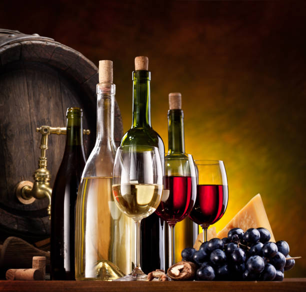 Still-life with wine, cheeses and fruits.