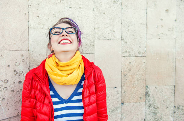 Happy beautiful fashion hipster woman laughing stock photo
