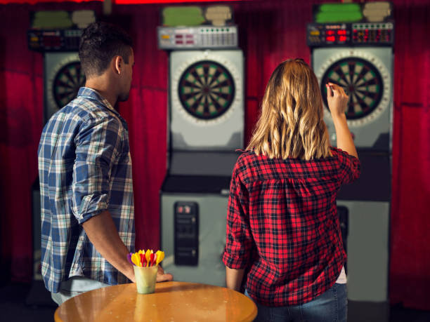 istock Young couple playing darts 915256034