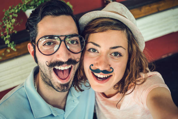 istock Hipster couple making funny selfies 915259822