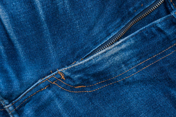 istock male blue denim jeans, open zip front background 915260212