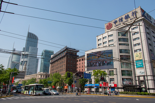 Modern Shanghai street corner with traffic.