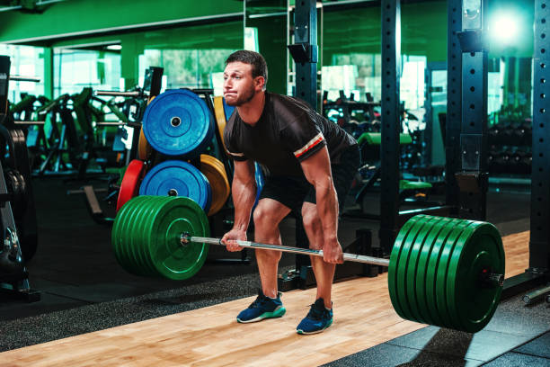 Muscular Man Doing Heavy Deadlift Exercise