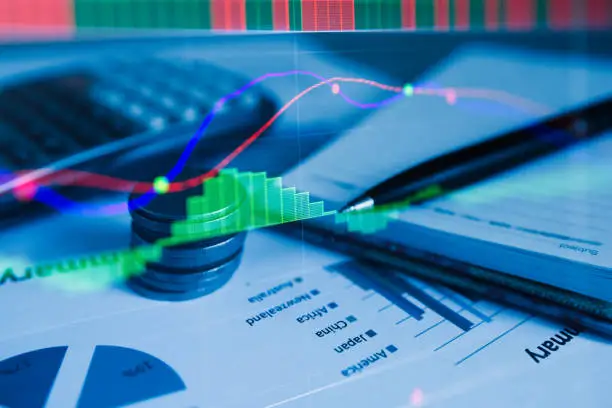 Photo of Stack coin money with report finance and banking with profit graph of stock market trade indicator financial.Double exposure style