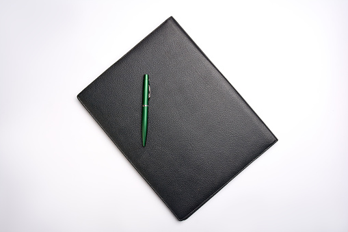 Black leather folder on white background