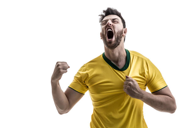 brazilian male athlete / fan celebrating on white background - fan sport football male imagens e fotografias de stock