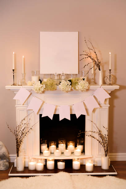 istock Fireplace decorated for Easter. A view on a fair white fireplace in warm candlelight making an Easter atmosphere with decorations. Place for text. 915277492
