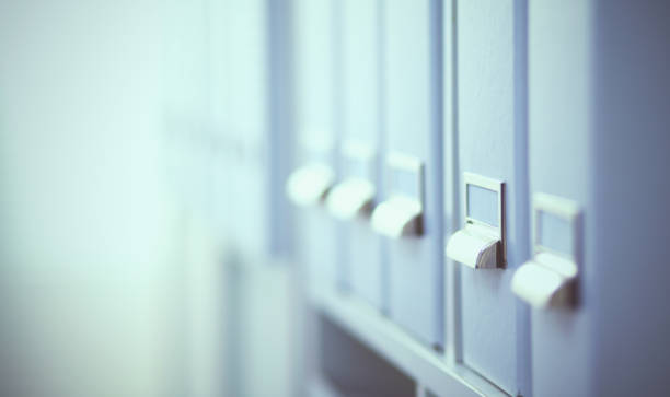 istock File folders, standing on  shelves in the background 915279996