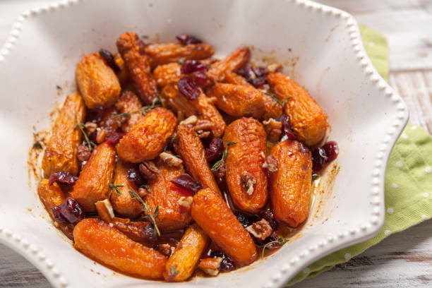 istock Honey Glazed Baby Carrots With Cranberry, Thyme and Nuts 915281452