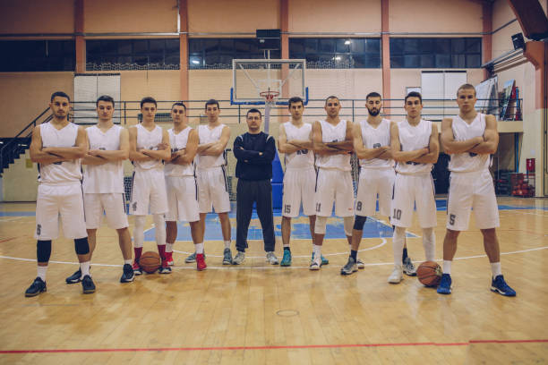 istock Basketball team on court 915284372