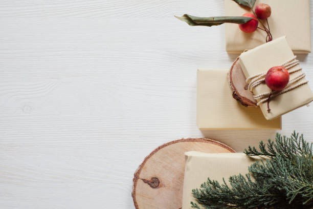 istock Christmas presents with apples and ribbon on white table 915284622