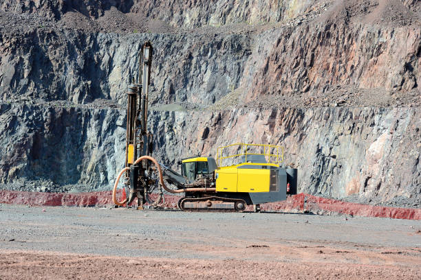 istock Mining driller and safety web in front of the mine. Quarry 915287924