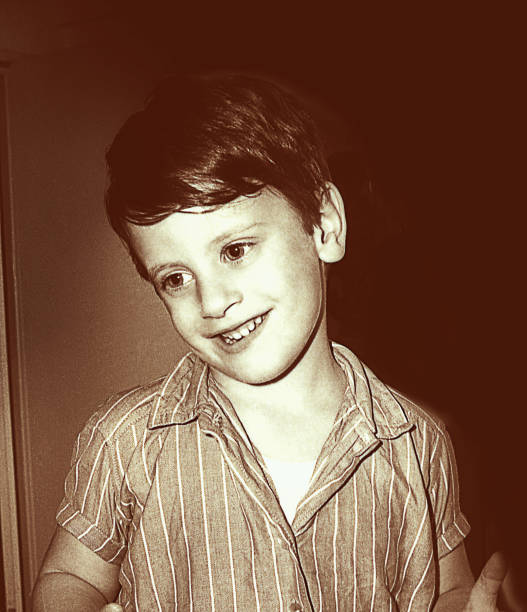 vintage black and white portrait of a smiling boy - 20th century style flash imagens e fotografias de stock