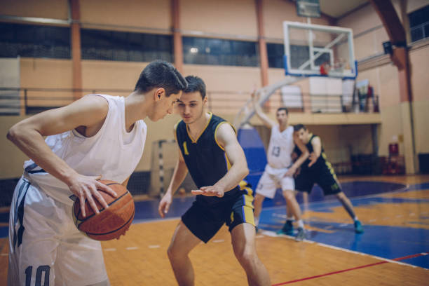 istock Guys playing basketball 915291836
