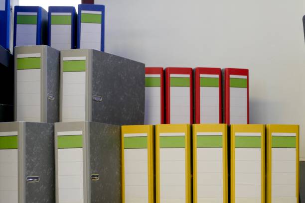 istock Colorful ring binders standing on the wooden staircase 915297066