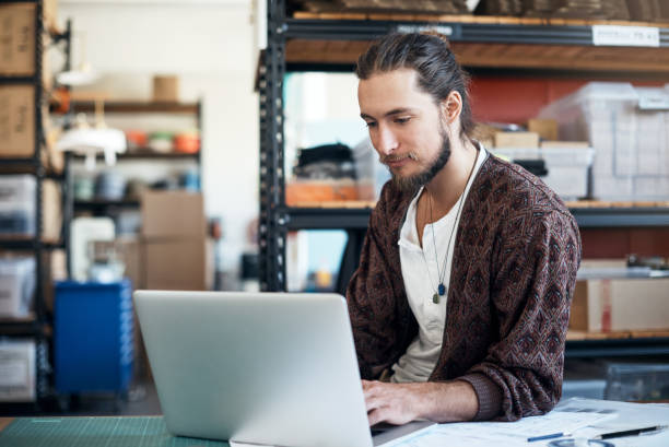 istock Recording his ideas on his device 915297424