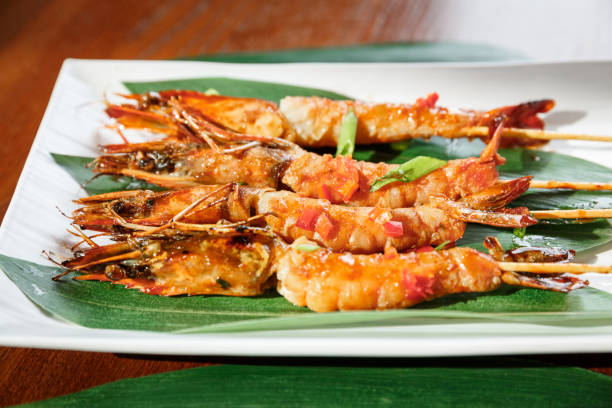 istock Fried hot big size shrimps  on sticks 915297790